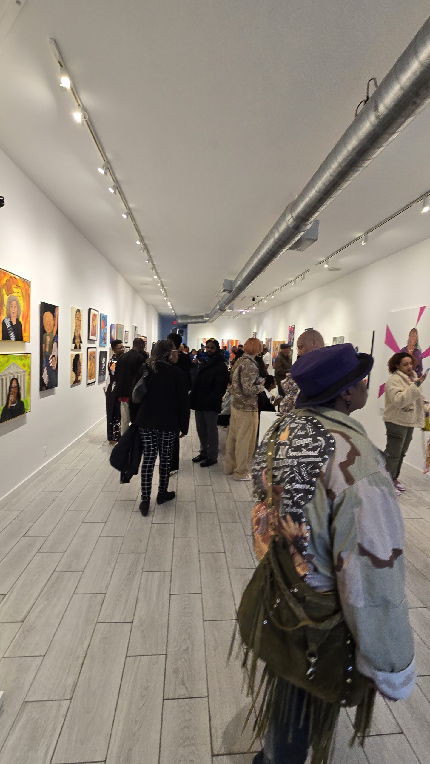 Visitors viewing artwork at BAT exhibition
